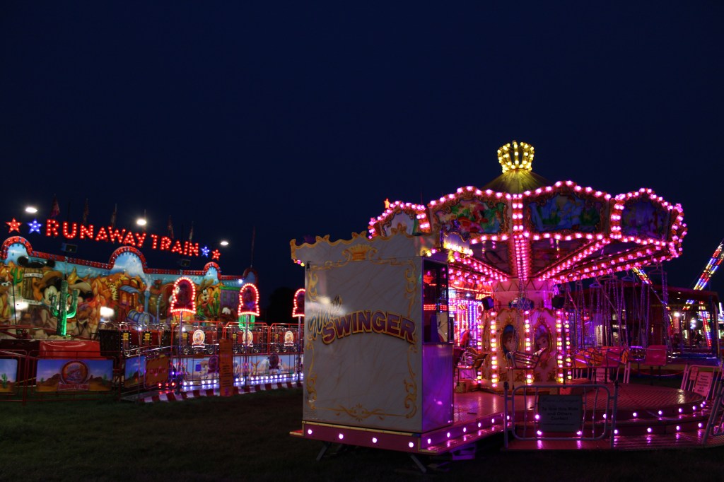 Two rides at a funfair. 