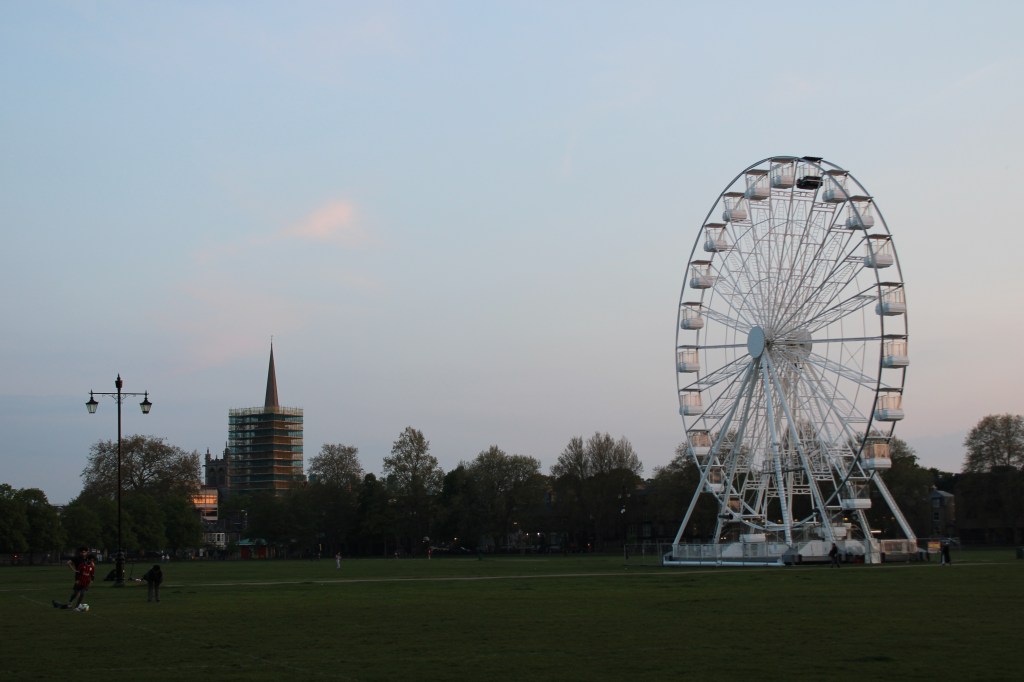 The Cambridge wheel with the catholic church in the background. The two tallest points in the city. 